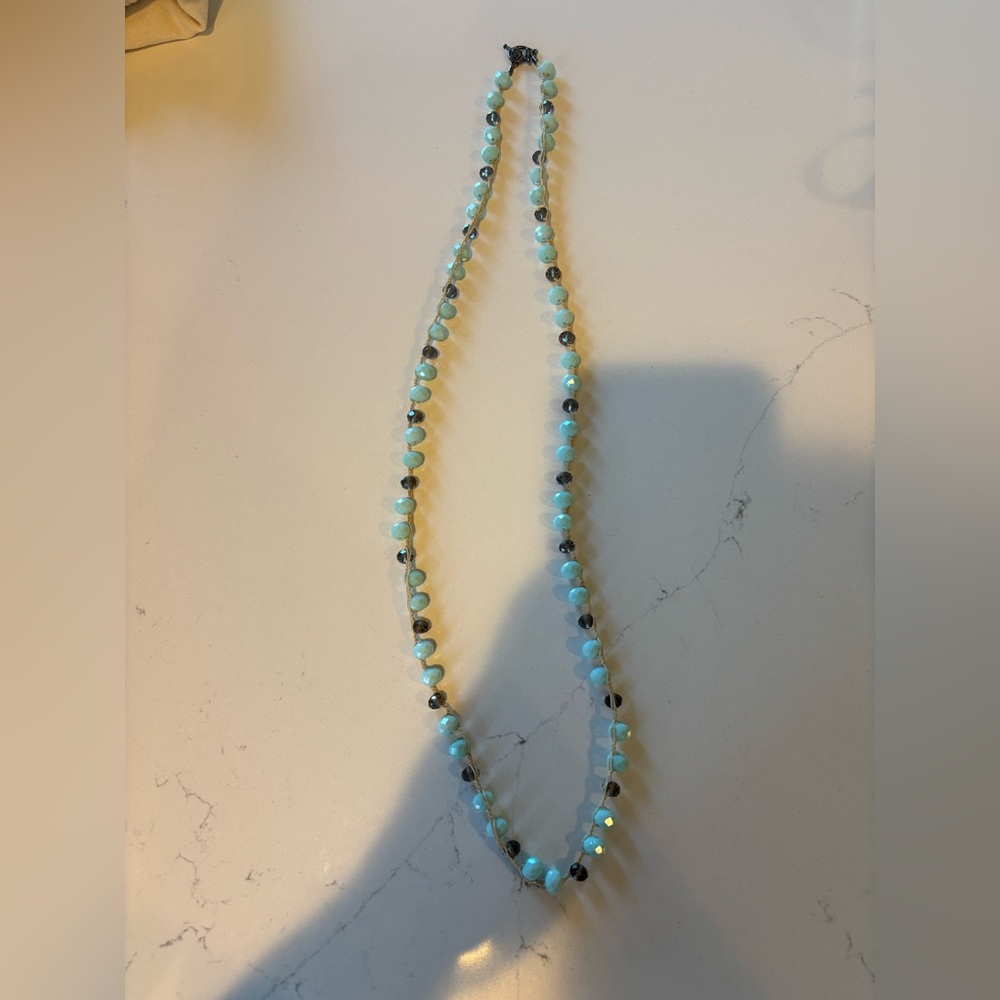 Handled beaded long necklace